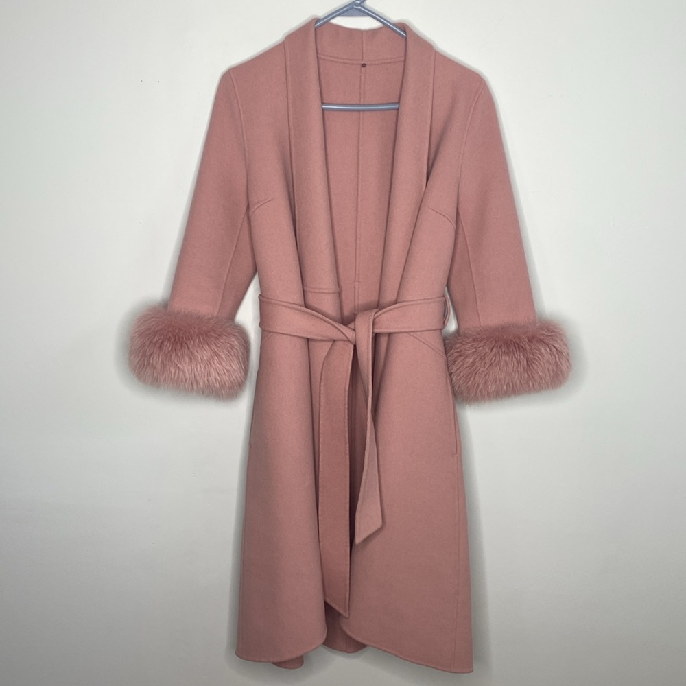 Pink wrap coat with for cuffs belted three quarter length sleeve with pockets